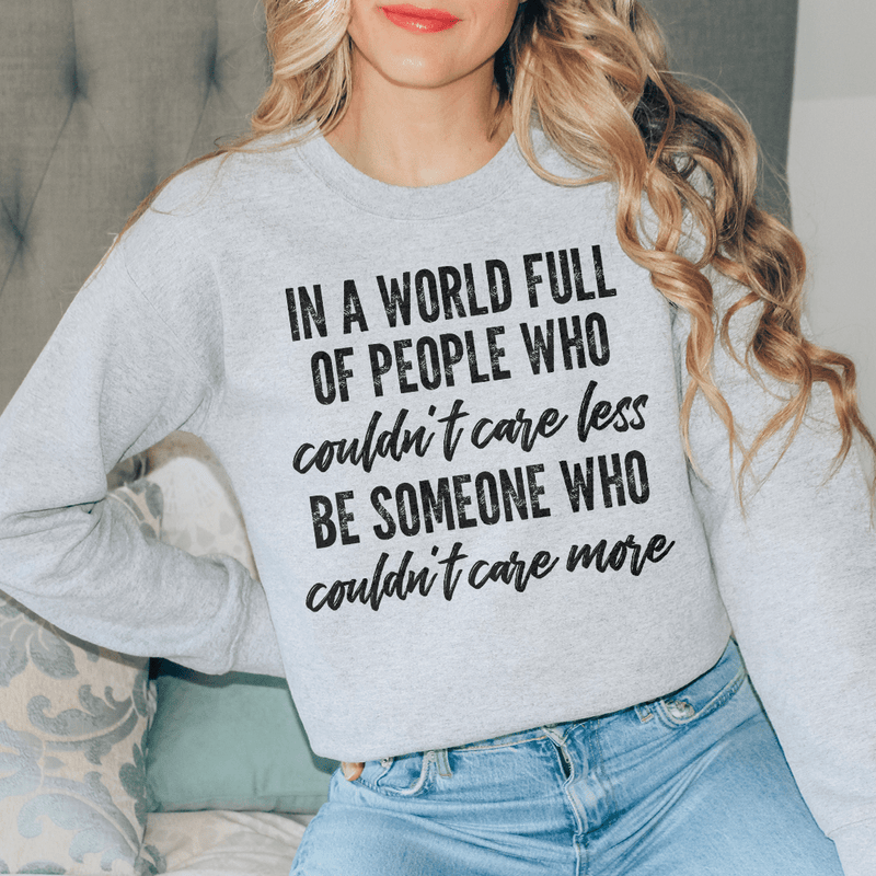 In A World Full Of People Who Couldn't Care Less Be Someone Sweatshirt Sport Grey / S Peachy Sunday T-Shirt