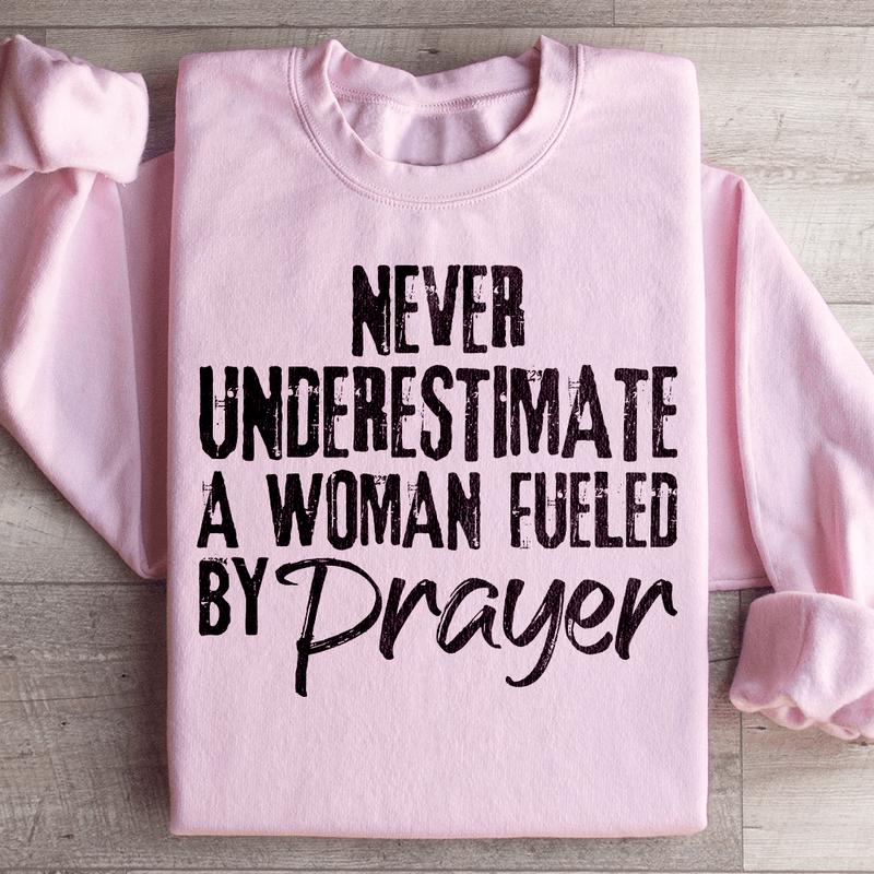 Never Underestimate A Woman Fueled By Prayer Sweatshirt Light Pink / S Peachy Sunday T-Shirt