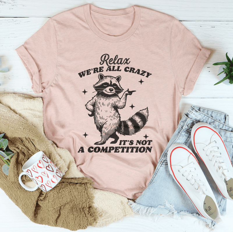 Relax We're All Crazy It's Not A Competition Raccoon Tee Heather Prism Peach / S Peachy Sunday T-Shirt